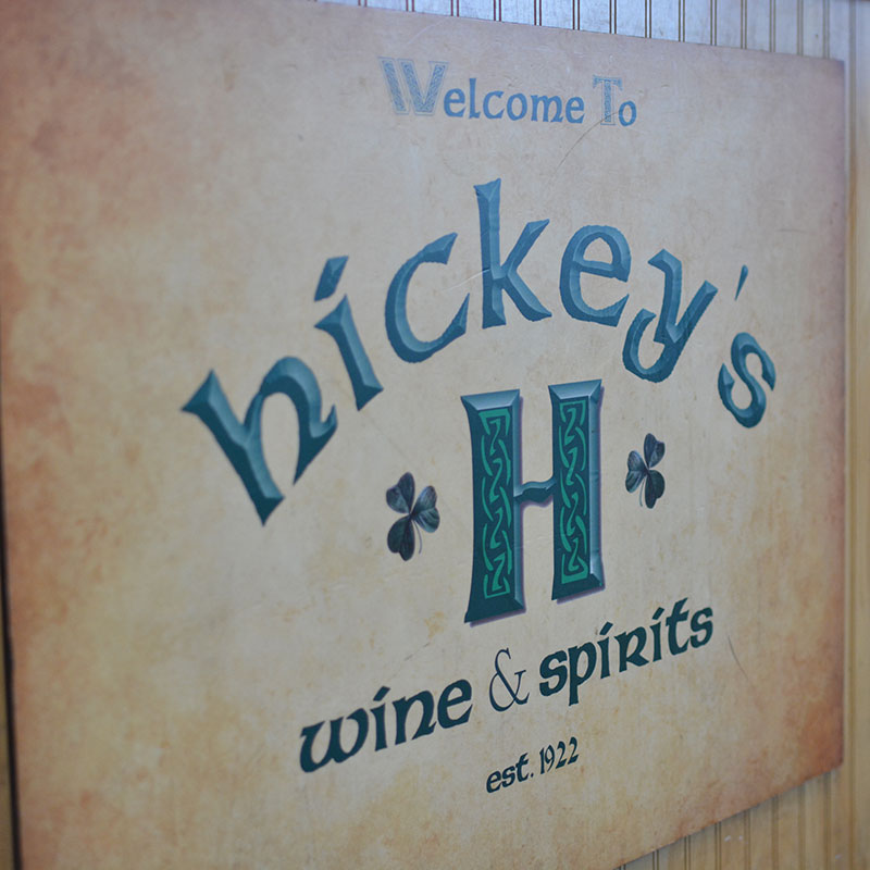 Close up of Hickey’s Wine & Spirits welcome sign.