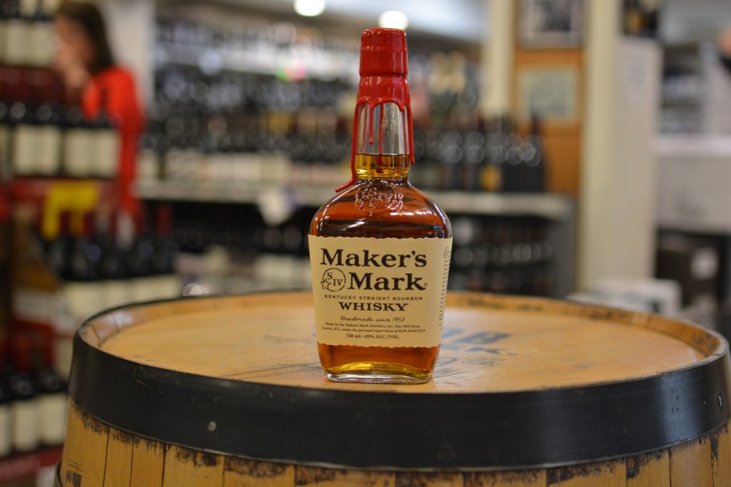 Bottle of Maker's Mark whiskey sitting on a display barrel in Hickey's.